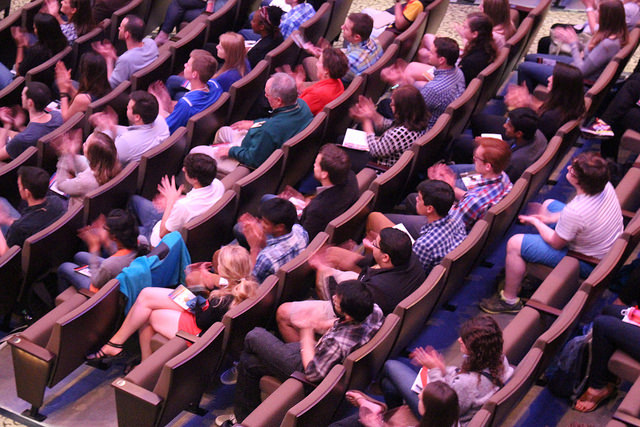 Auditorium filled with people.