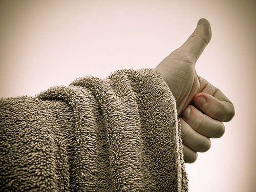 A hand with the thumb up.