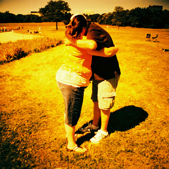 Two people hugging.