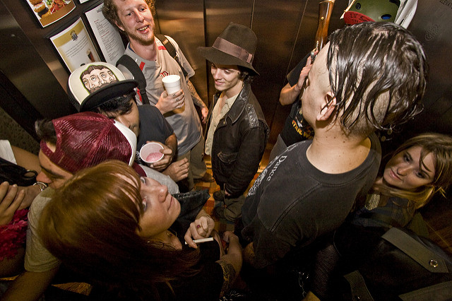 People in a crowded elevator.