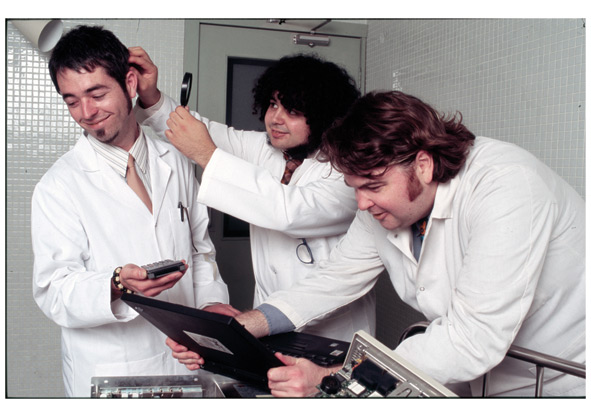 Three people in lab coats.