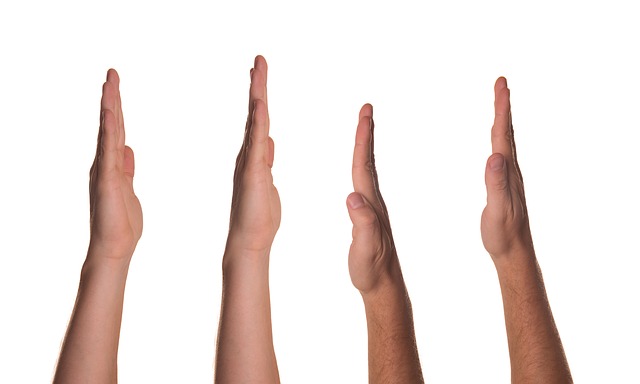 Four hands being held up.