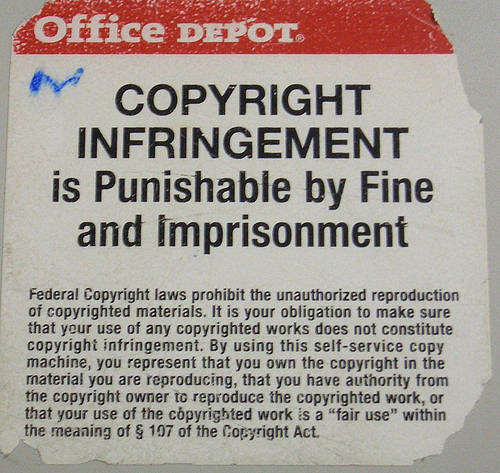 Sign with the words "Office Depot copyright infringement is punishable by fine and imprisonment." Underneath this heading there is an explanation of the legal implications of copyright infringement and the user's responsibility to ensure compliance.