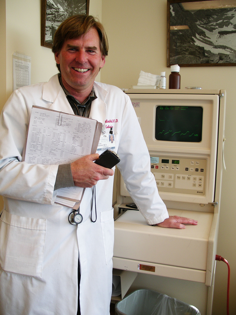 A doctor wearing a white lab coat.
