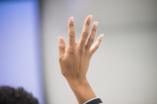 A woman's hand being held high.