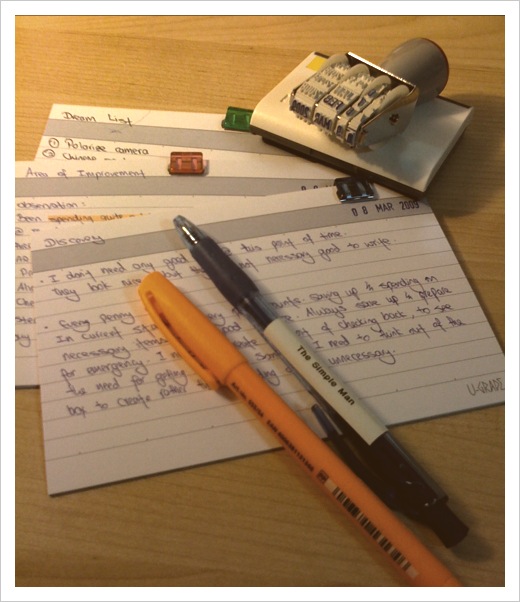 Speech talking points outlined on note cards with two pens and a date stamp.